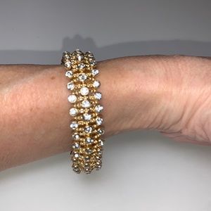 Pretty and sparkly 3 row rhinestone stretch bracelet in a gold metal setting